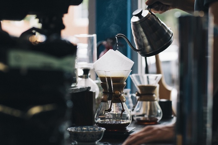 Coffee being poured through a filter - common mistakes when brewing coffee at home