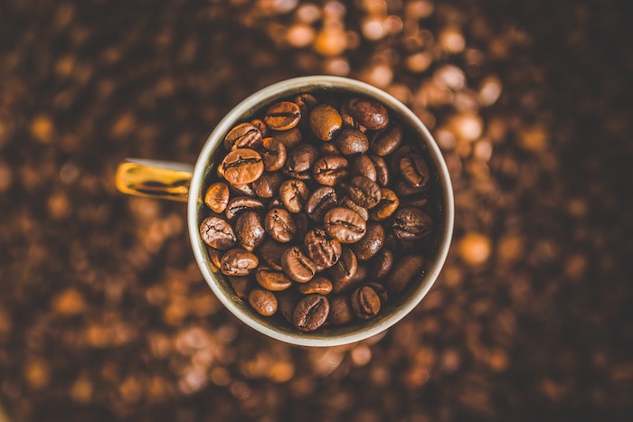 How many beans are in a cup of coffee - coffee mug full of coffee beans