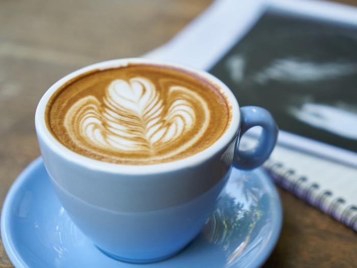 a hot latte with a pad on its side