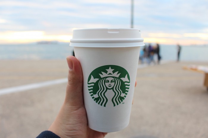 A take out cup of coffee from a coffee shop.