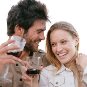 A group of people are drinking from a wine glass