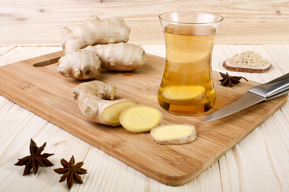 Ginger tea in a glass mug. One of the good teas for acid reflux.