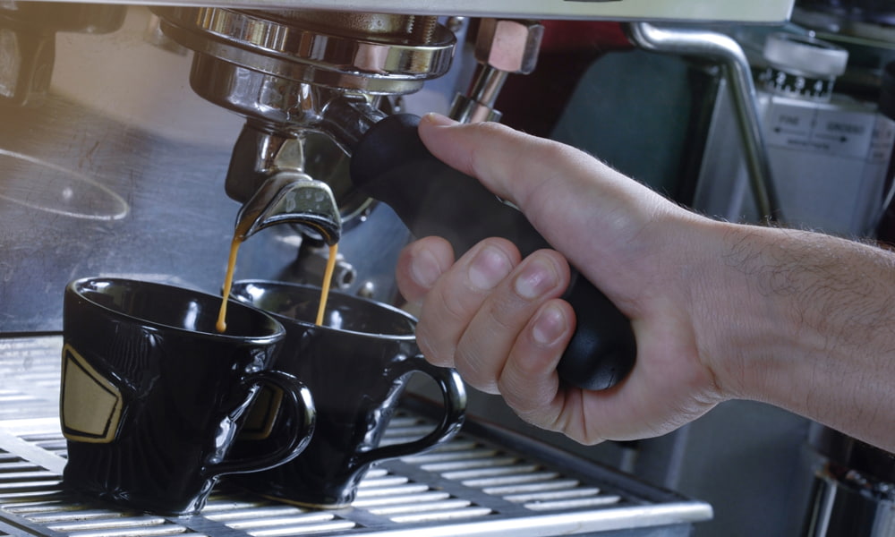 A pan of food, with Coffee and Machine