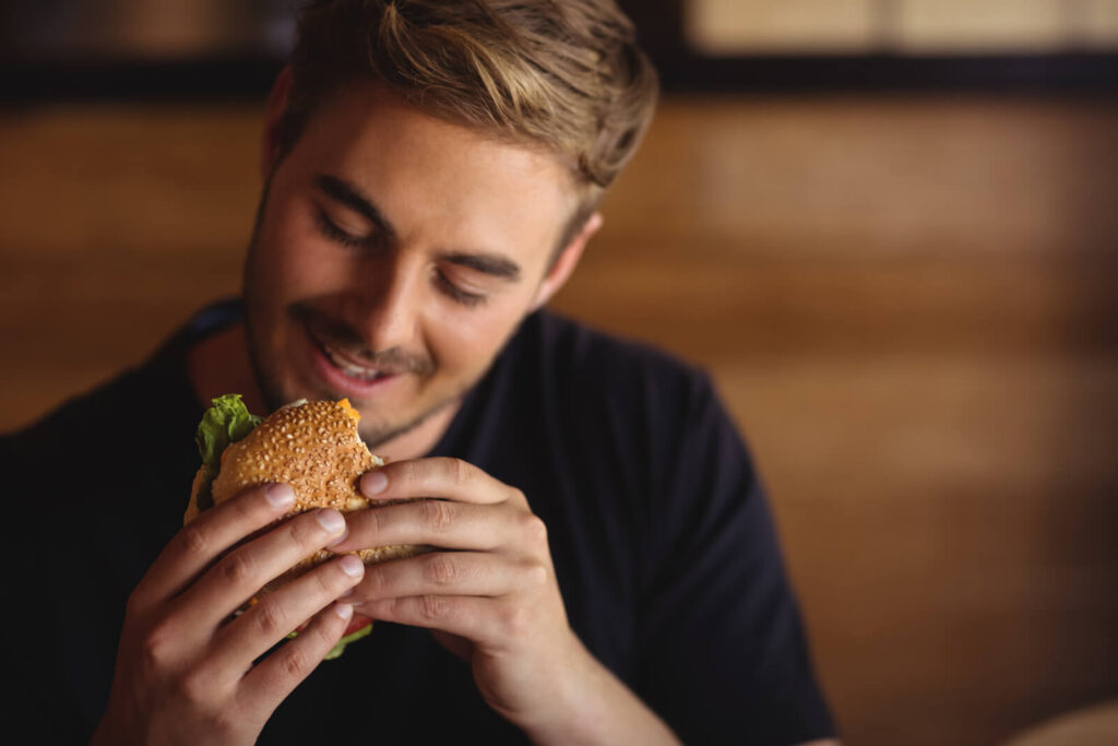 man eating a burger