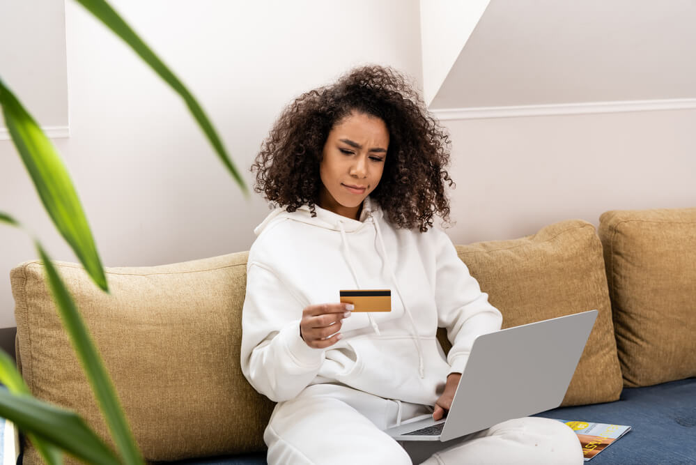 woman comtemplating wether to apply for a coffee subcription online