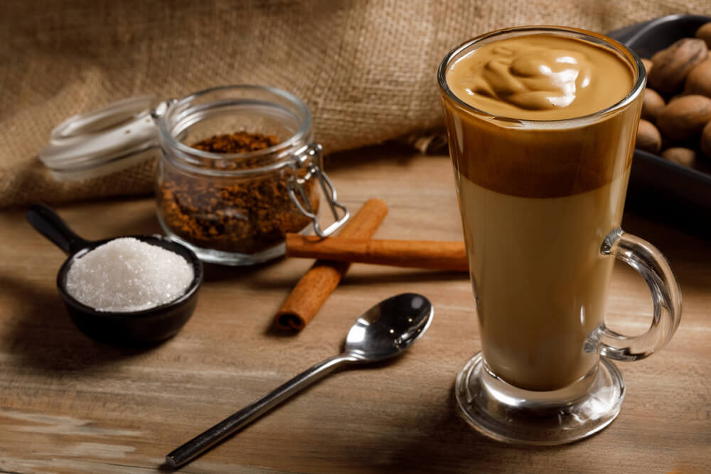 glass cup of tasty dalgona coffee in a table