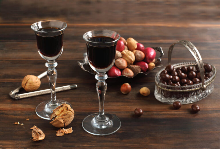 Two glasses of Coffee Liqueur, chocolate and nuts