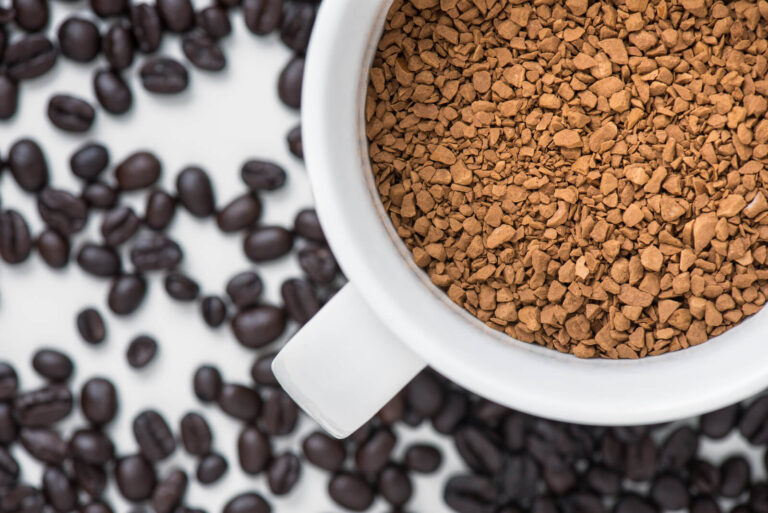 instant coffee in cup with coffe bean