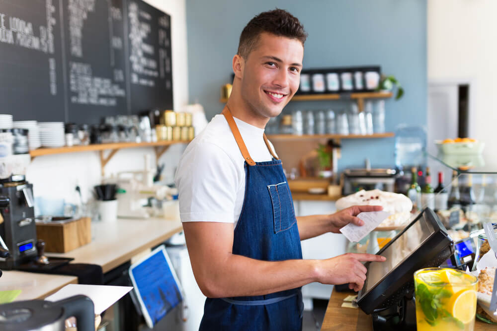 man working in a coffee shop - What To Wear When Working At A Coffee Shop