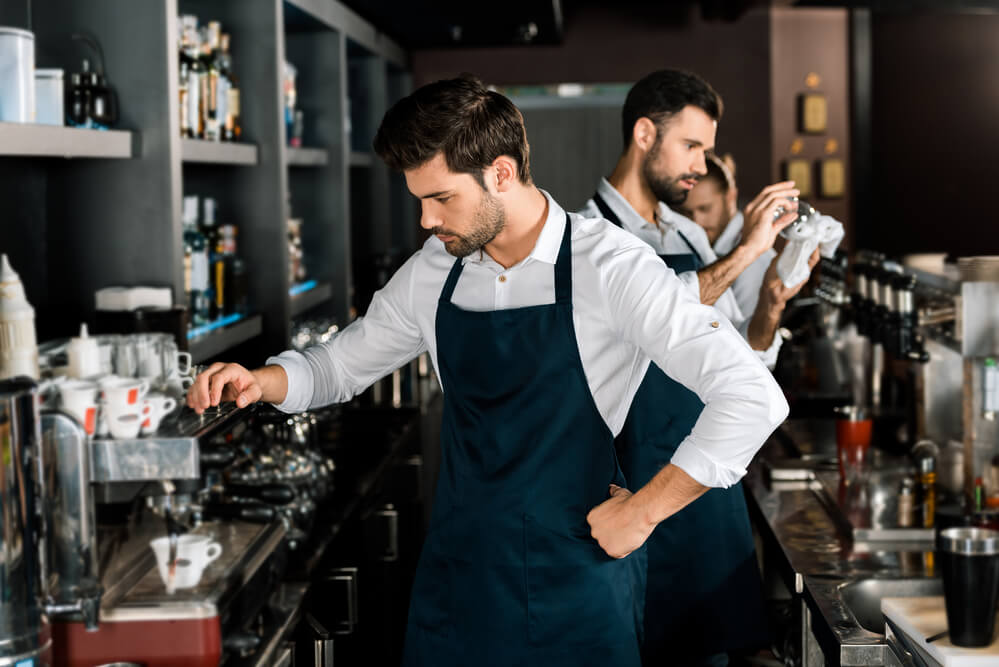 owner serving coffee for his coffee shop