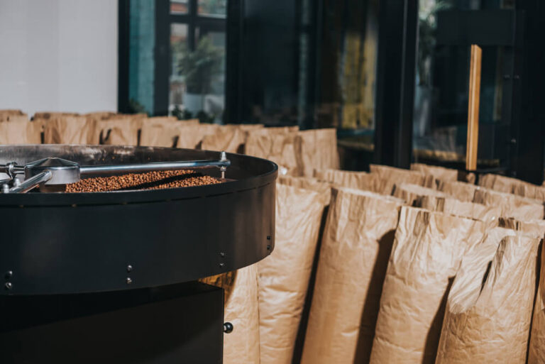 industrial coffee roaster with large paper bags