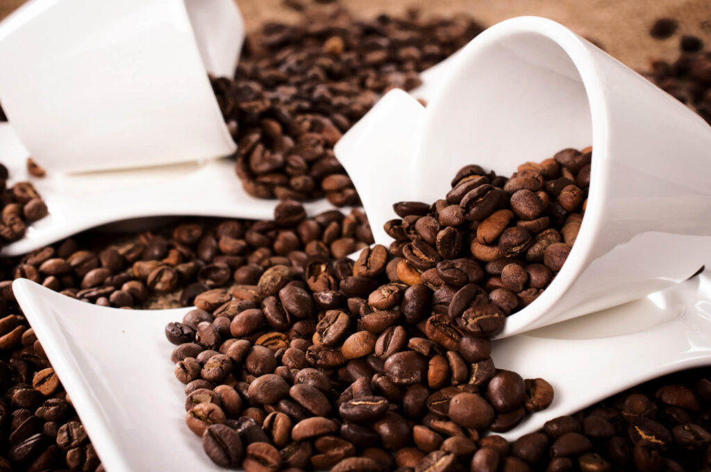 Arabica beans and two white cups