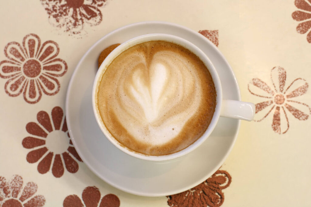 a short macchiato on top of a table