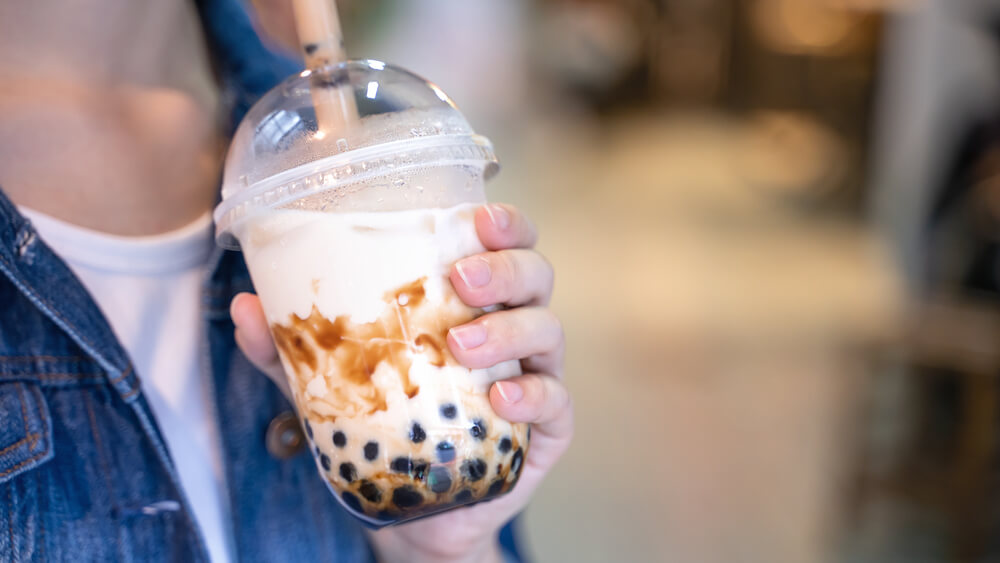 young woman drinking tapioca