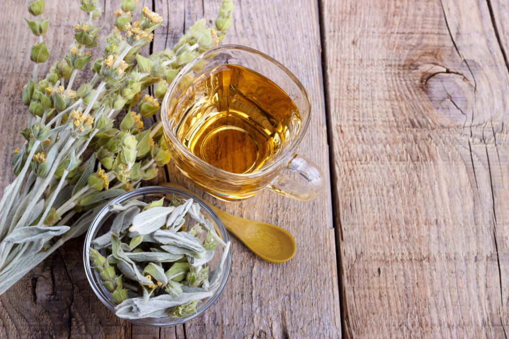 Sideritis herbal tea and flowers on wood - What is Sage tea