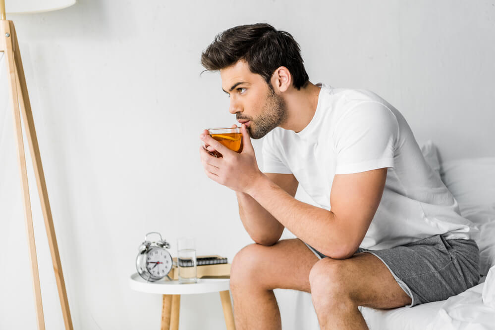 handsome man drinking ginseng tea