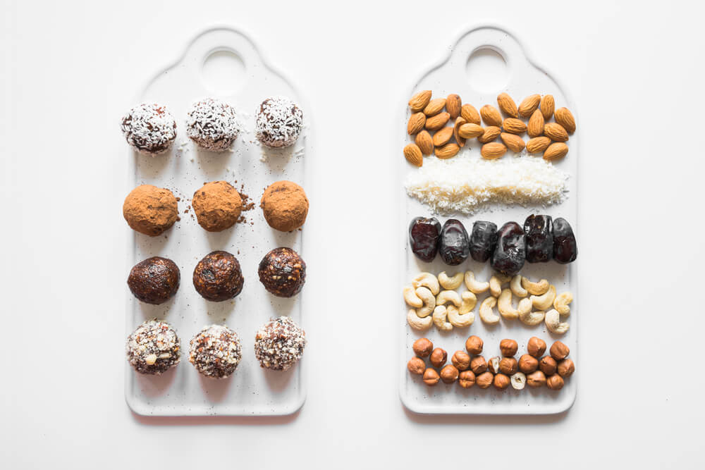 coffee energy balls laid out on a wooden surface