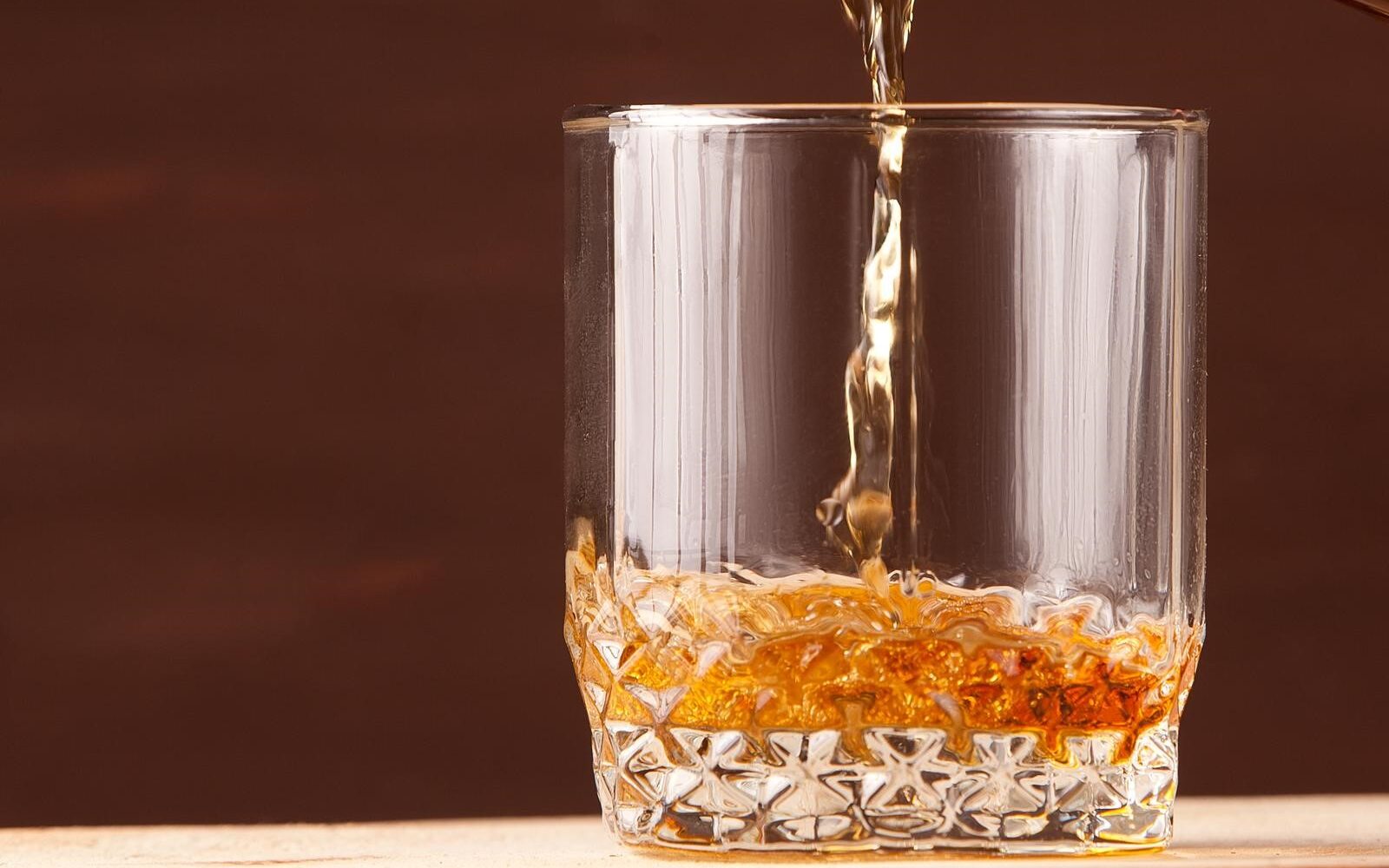 puring an irish whiskey on a glass