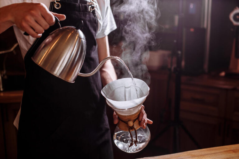 what is chemex coffee - barista pouring hot water to chemex