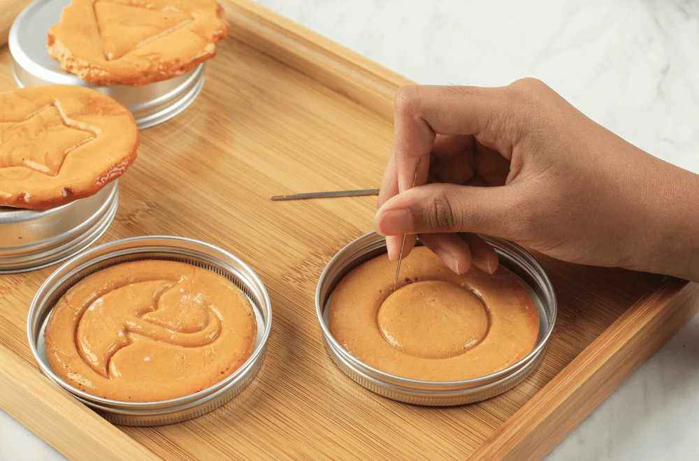 Hands closeup scratch brown sugar caramel candy cookies