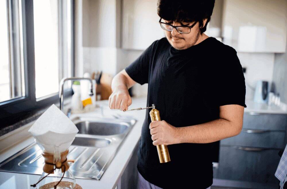 Man grinding coffee