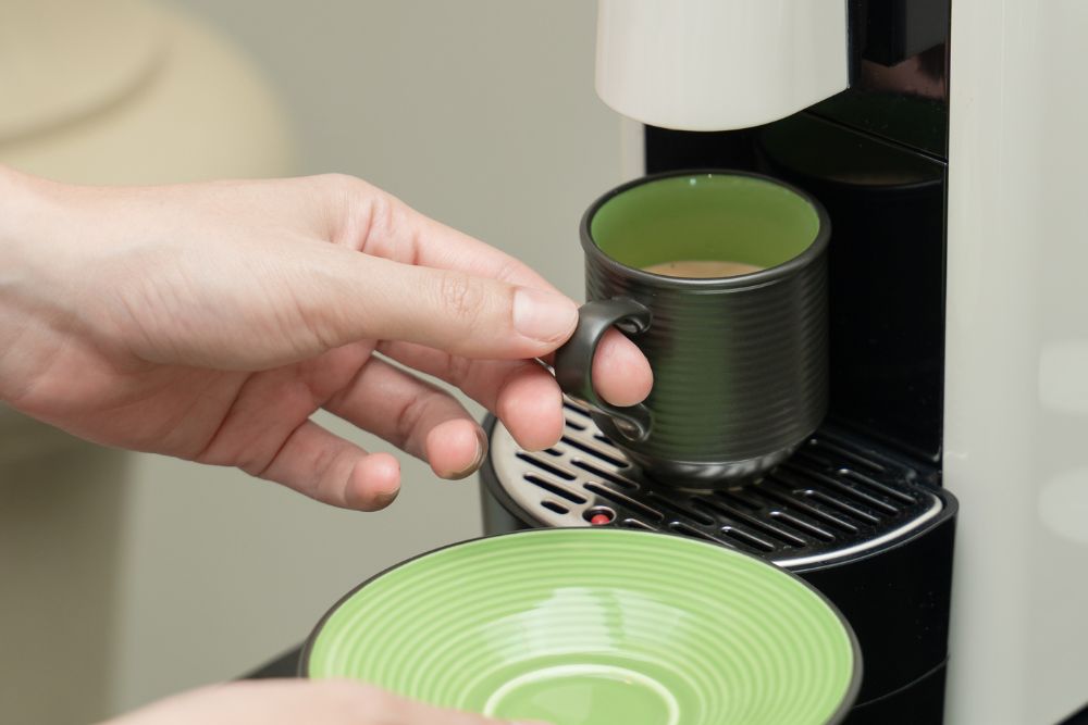 Capsule coffee machine making coffee