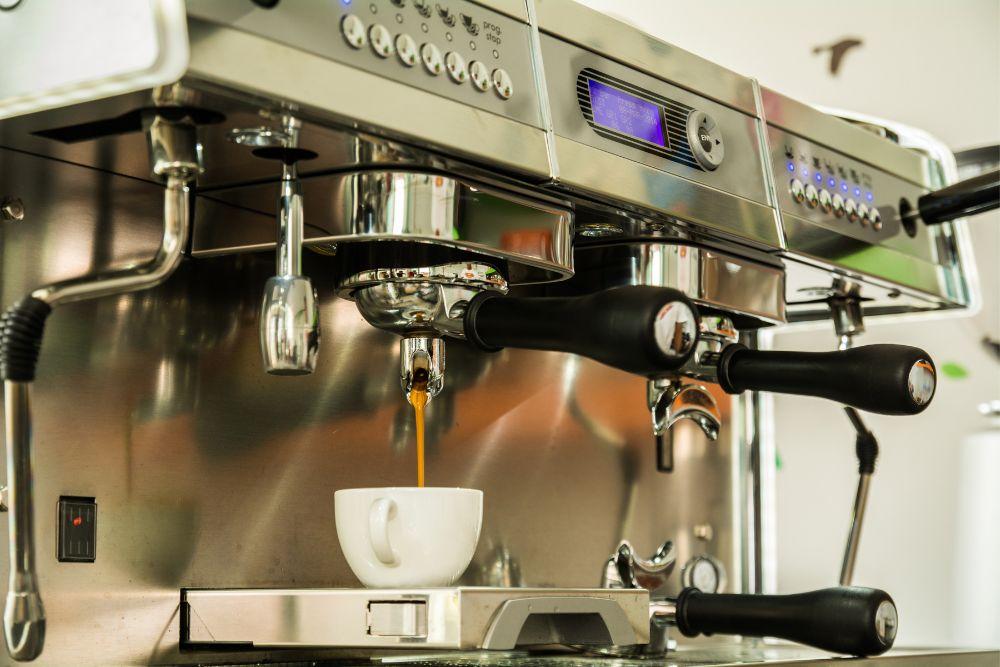 Professional coffee machine making espresso in a cafe