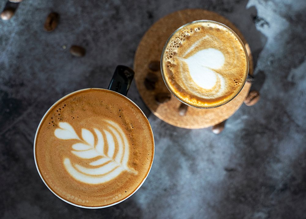 Spanish latte coffee cup concrete background latter art , coffee beans