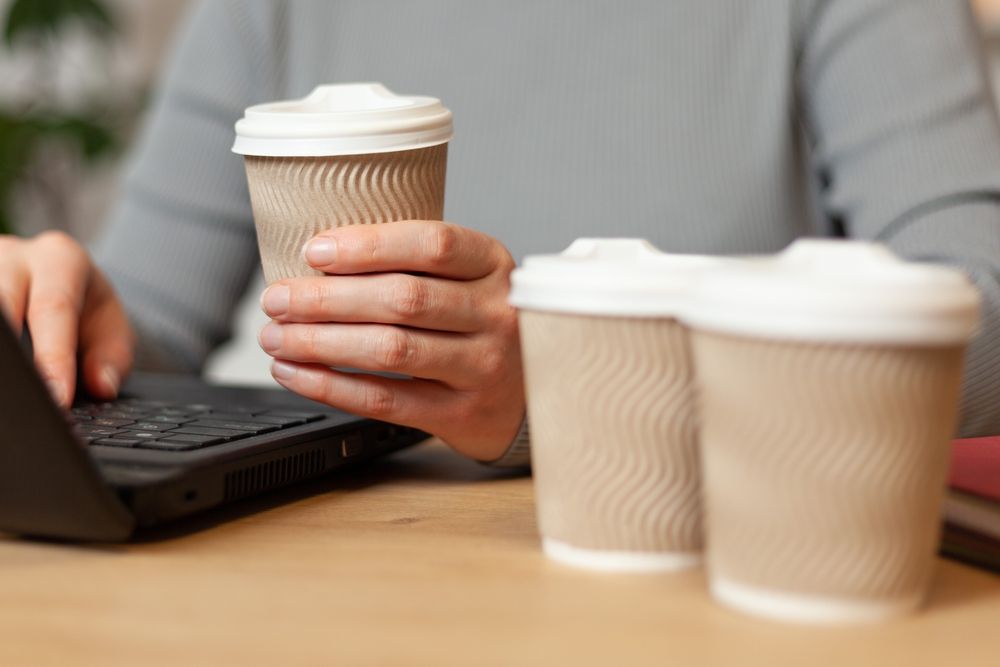 Coffee addiction in the morning. Caffeine abuse at work