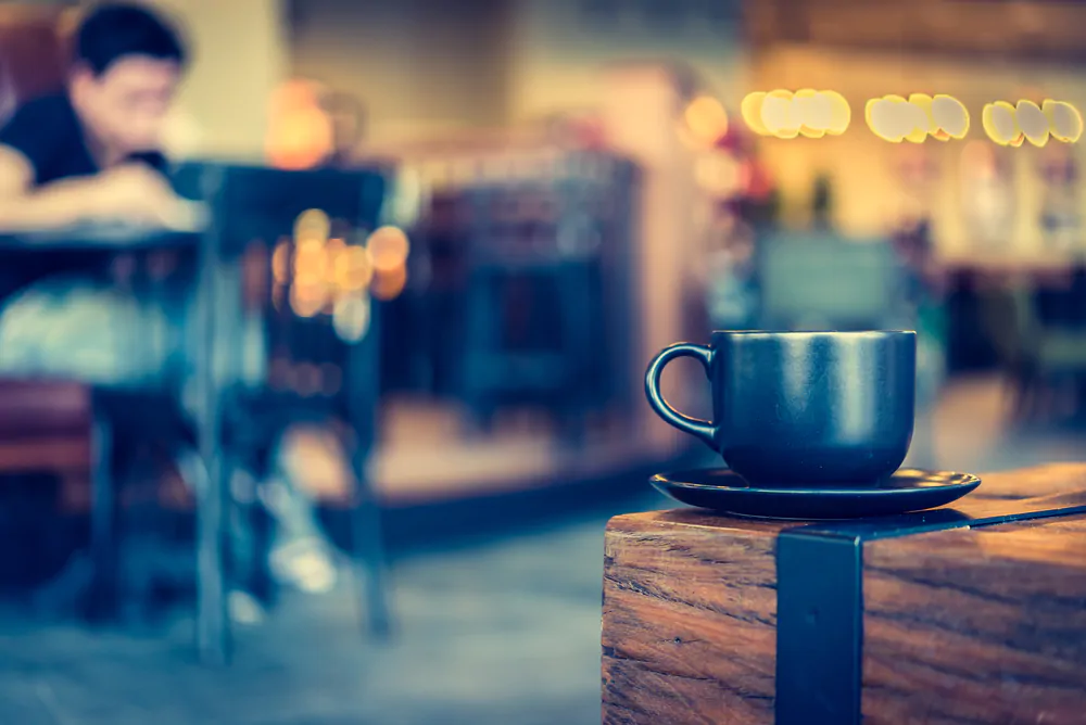 Dark coffee cup on a table.