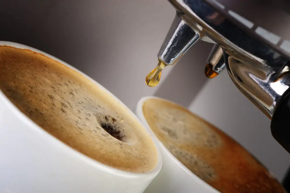 A cup of black coffee from a coffee machine.