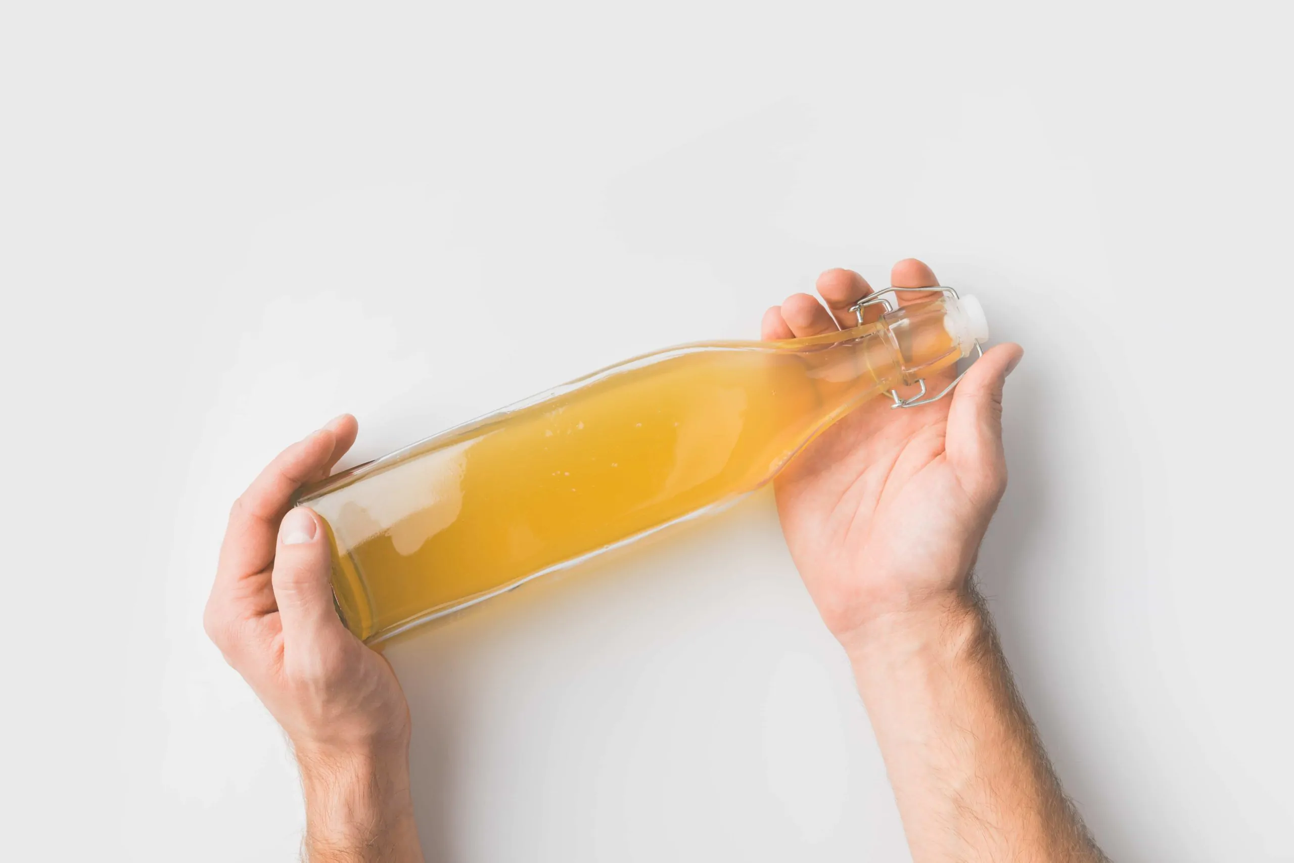 A glass of orange juice, with Cider and Vinegar