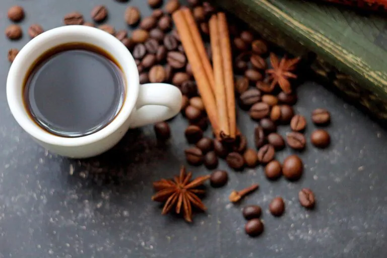 a cup of black coffee and a spice