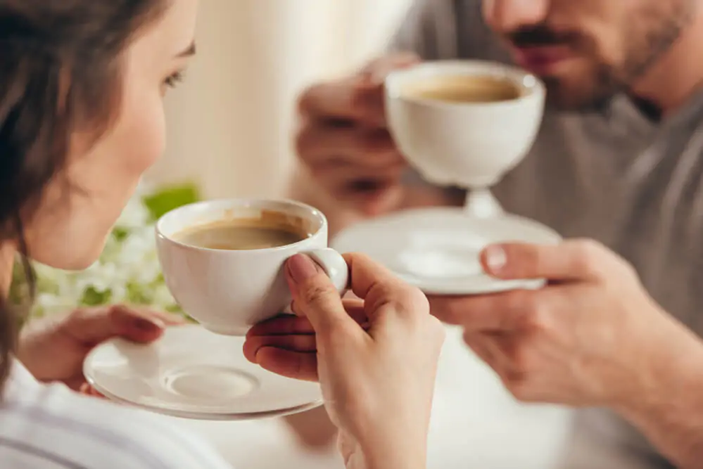 a couple enjoying their cup of coffee