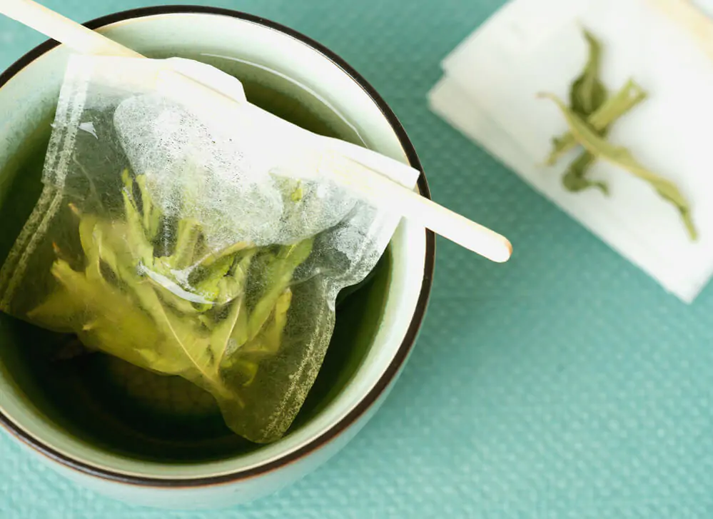 Lemon Verbena tea in a mug with hand made teabag - What is a verveine tea