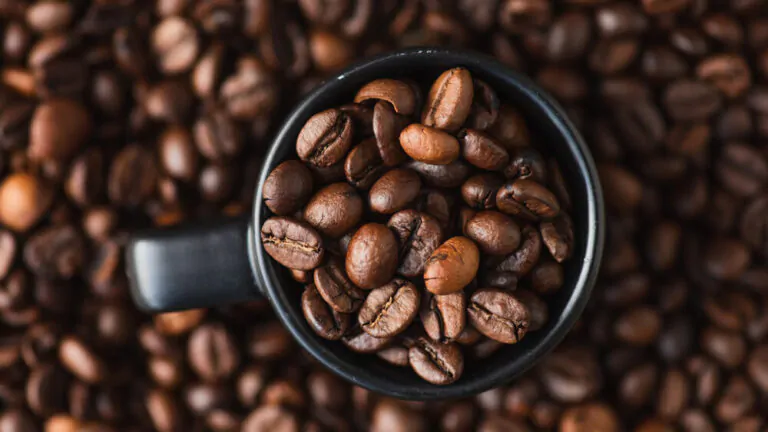 a mug full of coffee beans